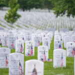 Flags, flowers and other mementos adorn headstones in Section 60 of Arlington National Cemetery, Arlington, Virginia, May 27, 2018. Every year over Memorial Day weekend, more than 135,000 visitors come to Arlington National Cemetery to honor those who have died while in the armed forces. (U.S. Army photo by Elizabeth Fraser) www.dvidshub.net